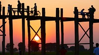 People on pier at sunset. Free public domain CC0 photo.