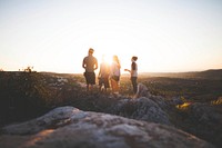 Free group of friends on hill with sunset image, public domain person CC0 photo.