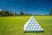 Free pile of golf balls on grass field photo, public domain sport CC0 image.