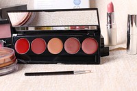Lips palette with mirror, small brush and lipstick, free public domain CC0 photo.