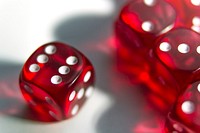 Red dice on the table close up, free public domain CC0 photo.