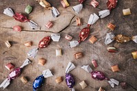 Free Halloween candy on wooden table photo, public domain CC0 image.