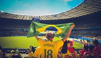 Brazil fan cheering on football match, location unknown, 8 March 2017. View public domain image source here