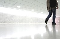 Free man walking in white room image, public domain human CC0 photo.