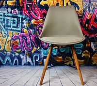 Free chair in front of street art photo, public domain art CC0 image.