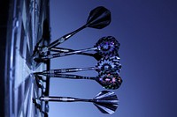 Free darts on dartboard, side shot image, public domain game CC0 photo.