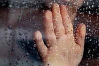 Free hand on window raining image, public domain CC0 photo.