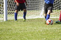 Free men playing a soccer game on field image, public domain sport CC0 photo.