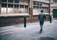Free man walking alone in the city street image, public domain CC0 photo.