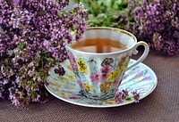 Free herbal tea in floral teacup photo, public domain beverage CC0 image.