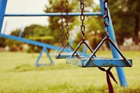 Swing in playground. Free public domain CC0 image.