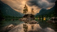 Thunderstorm lake reflections in mountain range landscape, free public domain CC0 photo.
