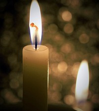 Free candle lights fire in dark background photo, public domain CC0 image.