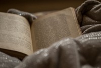 Free old open book on a blanket photo, public domain CC0 image.