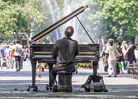 Man playing piano in public image, public domain musician CC0 photo.