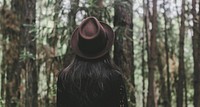 Free woman standing in forest image, public domain nature CC0 photo.