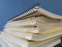 Free stack of spiral notebook image, public domain CC0 photo.