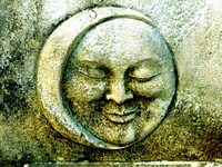 Free moon face on a wall image, public domain statue CC0 photo.