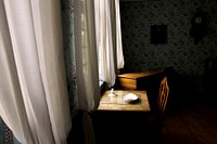 Desk by the curtain. Free public domain CC0 photo.