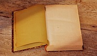 Free vintage blank open notebook on wooden table photo, public domain CC0 image.