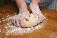 Free person kneading dough photo, public domain CC0 image.