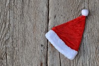 Free Christmas hat on wood table image, public domain holiday CC0 photo.