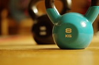 Free weight kettlebells on floor closeup image, public domain sport CC0 photo.