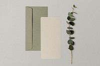 Beige blank card, green envelope, botanical design