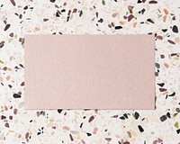 Blank pink paper on terrazzo background, feminine style