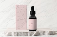 Beauty serum dropper bottle, pink paper box, skincare product packaging