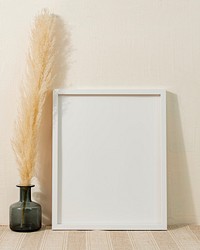 Empty picture frame, clean beige home interior decor
