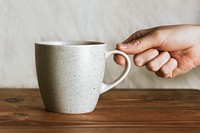 Coffee mug mockup psd, hand reaching for cup