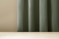 Green curtain product backdrop, wooden table with blank space