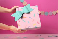 Hand holding gift box, birthday present aesthetic