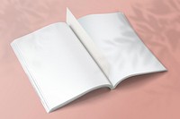 Open blank book on pink background 