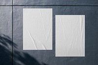 Blank white poster with design space on concrete wall