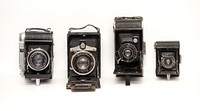 Vintage cameras lined up on white background, 16 October 2016.