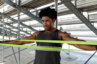 Male athlete using a resistance band