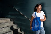 Confident Latina woman with a tote bag, be kind to yourself and share it with the world