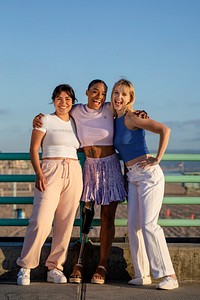 Three girlfriends posing, hanging out by the Venice beach