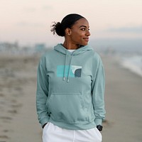 Woman wearing a streetwear hoodie, blue abstract design