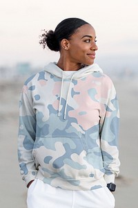 Beautiful woman at the beach, blue camouflage streetwear hoodie