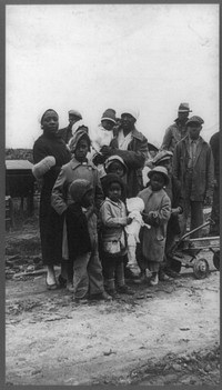 Parkin (vicinity), Arkansas. The families of evicted sharecroppers of the Dibble plantation. They were legally evicted the week of January 12, 1936. The plantation having charged that by membership in the Southern Tenant Farmers' Union they were engaging in a conspiracy to retain their homes. This contention granted by the court, the eviction, though at the point of a gun, was quite legal. The pictures were taken just after the evictions before they were moved into the tent colony they later enjoyed. Sourced from the Library of Congress.