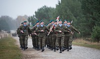Polish service members march during the opening ceremony for exercise Steadfast Jazz 2013 in Drawsko Pomorskie, Poland, Nov. 3, 2013.
