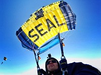 160225-N-VY375-092 HOMESTEAD, Fla. (Feb. 25, 2016) - Special Warfare Operator 1st Class Trevor Thompson, member of the U.S. Navy Parachute Team "The Leap Frogs," pilots his canopy during a training demonstration at Homestead Air Reserve Base. (U.S. Navy photo by Special Warfare Operator 1st Class Trevor Thompson/Released).