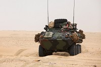 U.S. Marines with Weapons Company, Battalion Landing Team, 3rd Battalion, 5th Marine Regiment, 15th Marine Expeditionary Unit conduct a combat logistics patrol in a light armored reconnaissance vehicle Nov. 11, 2012, at a live-fire range near Camp Buehring, Kuwait, during exercise Eager Mace 13.