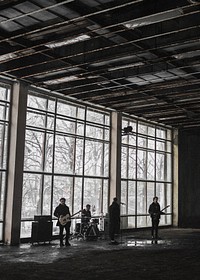 Rock band rehearsing in an abandoned building