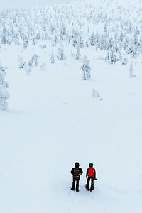Drone shot of landscape photographers trekking in Lapland, Finland