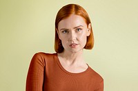 Ginger-haired woman in orange tee portrait