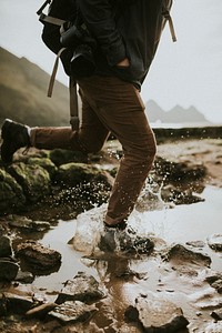 Hiker running through the water